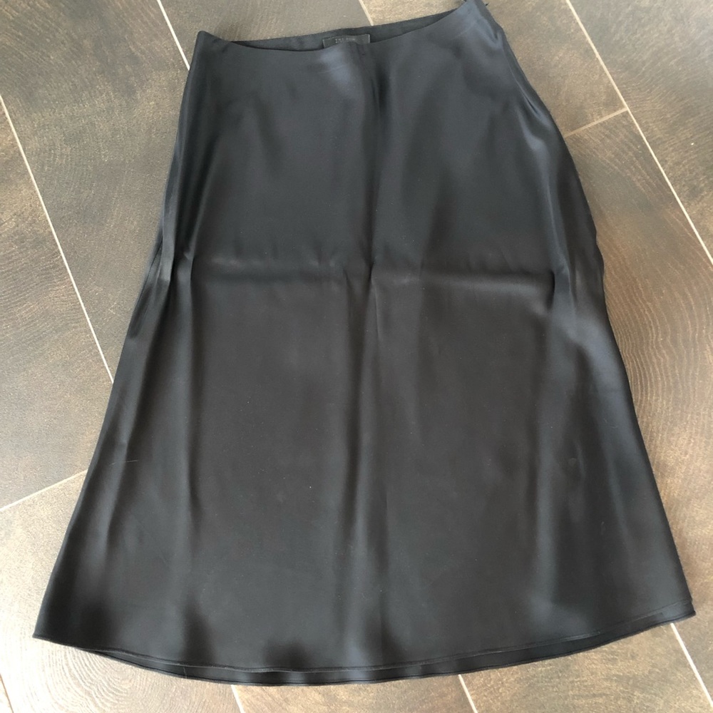 The Row black silk a line skirt.